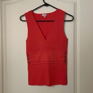 Orange blouse with bronze buttons on both sides